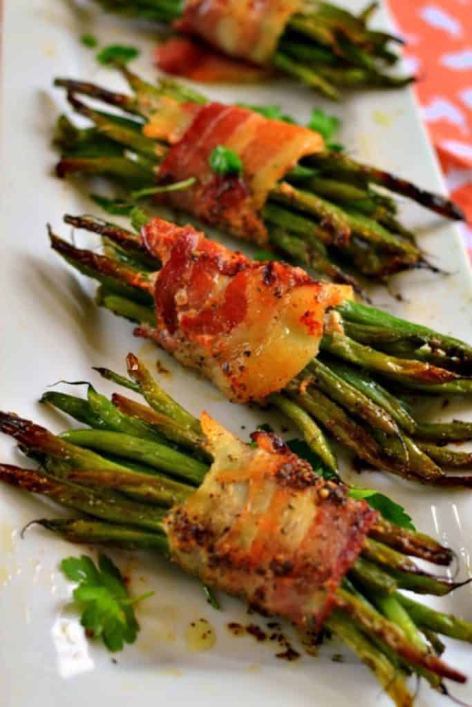 Green bean bundles on a serving plate. 