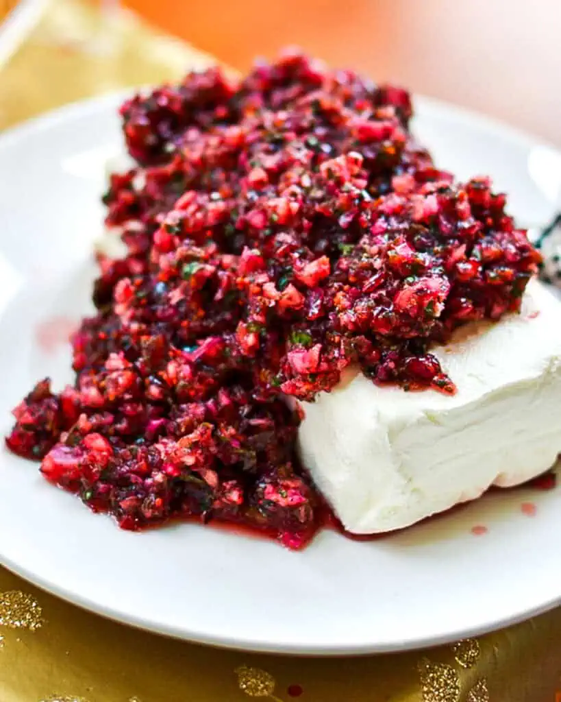 Cranberry salsa over a block of cream cheese. 