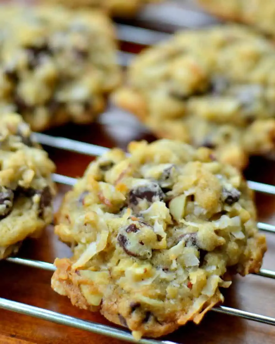 Freshly baked almond joy cookies cooling on a wire rack. 