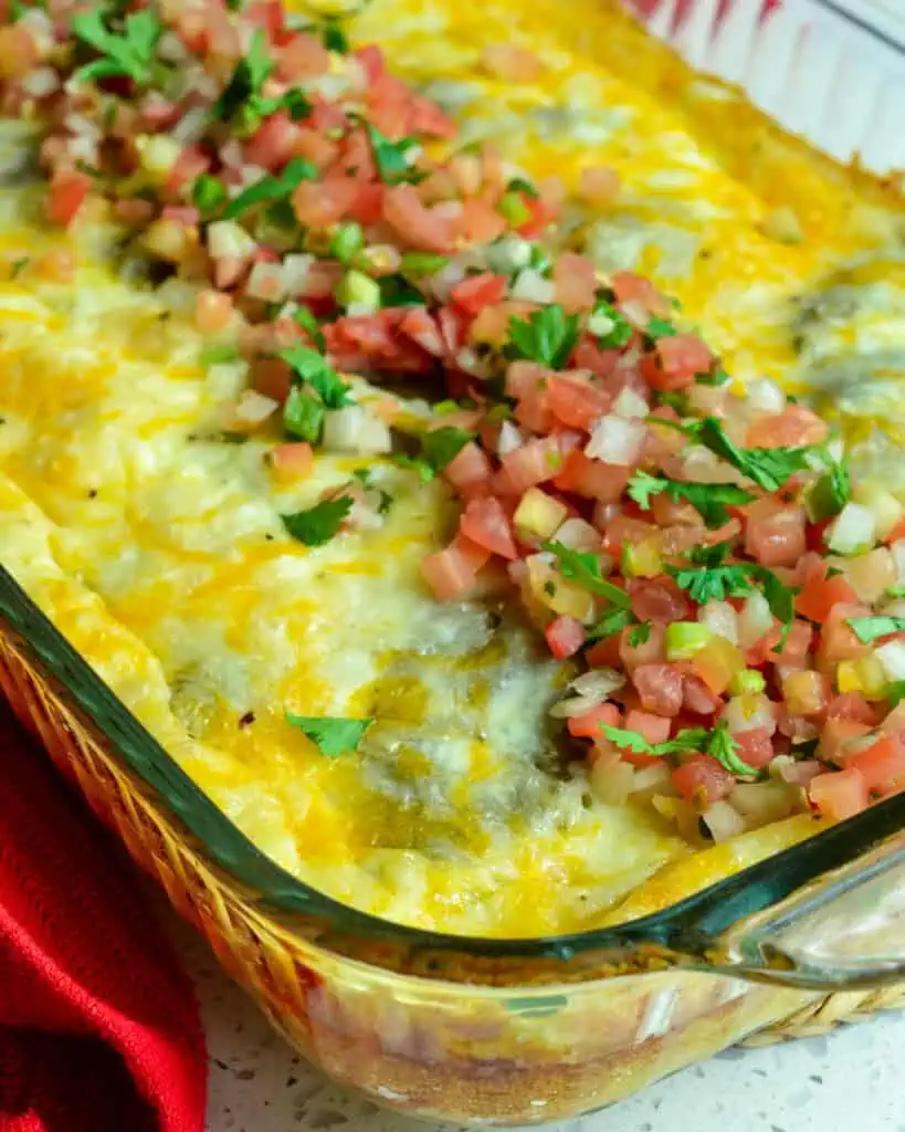 Chile relleno casserole with pico de gallo on it. 