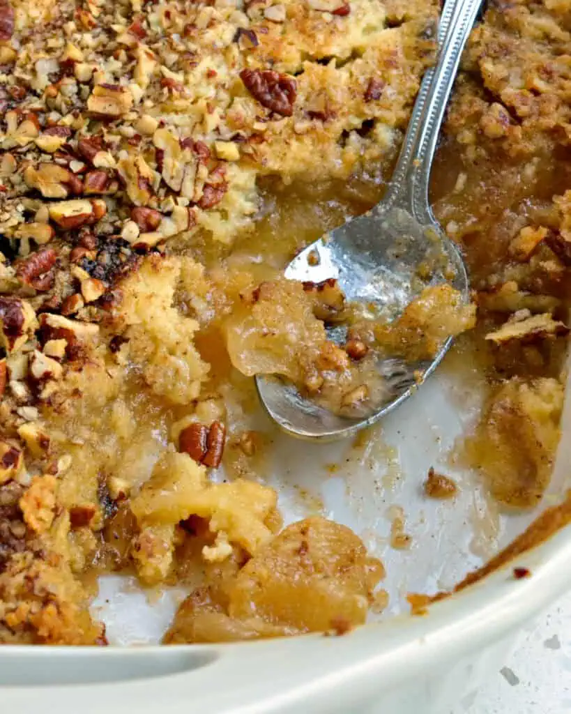 A casserole dish filled with apple dump cake. 