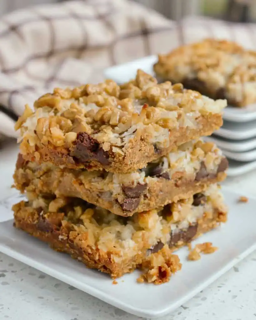 Magic Cookie Bars are loaded with chocolate chips, peanut butter chips, coconut, and walnuts.  