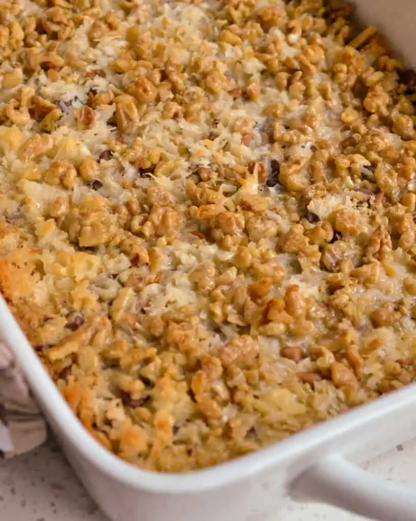 A 13x9 inch baking dish full of magic cookie bars. 