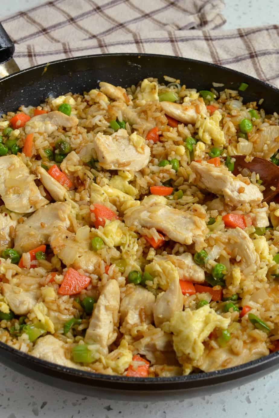 Chicken fried rice in a skillet. 