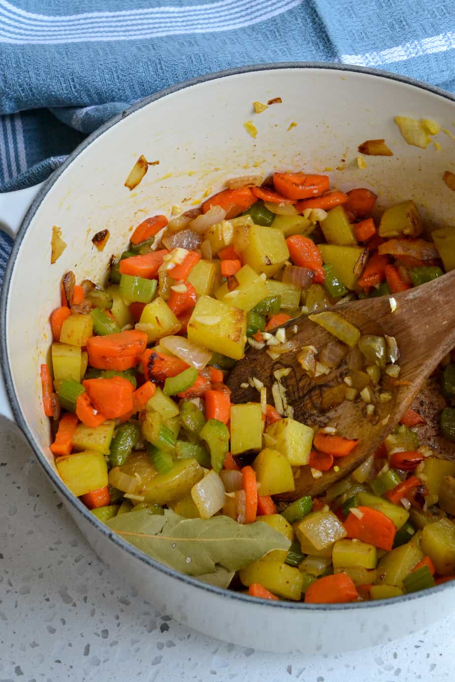 To make Zucchini Soup start by cooking the onions and celery until soft. 