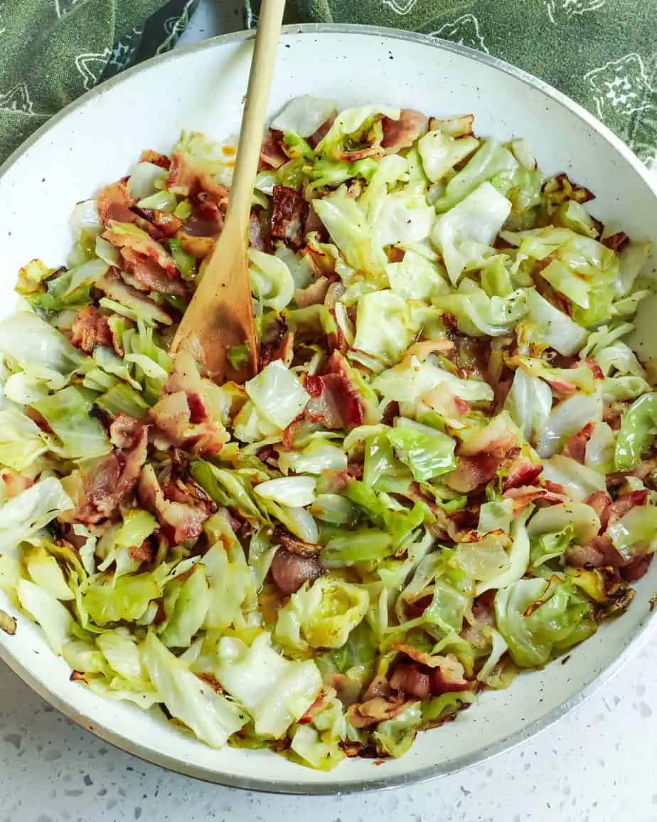 Cabbage and bacon in a large skillet. 