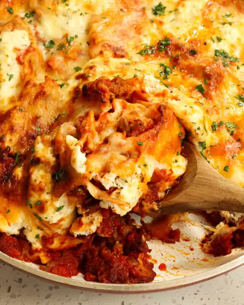 This one skillet lasagna combines Italian sausage, onion, garlic, and lasagna noodles all cooked up in marinara sauce and topped with ricotta cheese and mozzarella cheese.