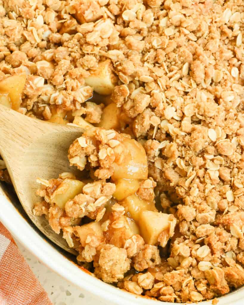 Apple Crumble with chunks of tart apples combined with cinnamon and nutmeg and topped with a crisp brown sugar and cinnamon oat topping. 