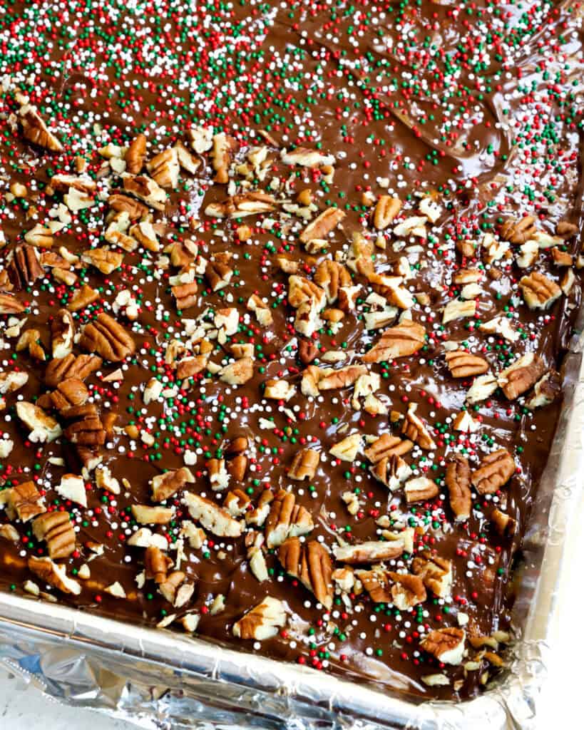 Christmas crack candy in a baking sheet covered with aluminum foil. 