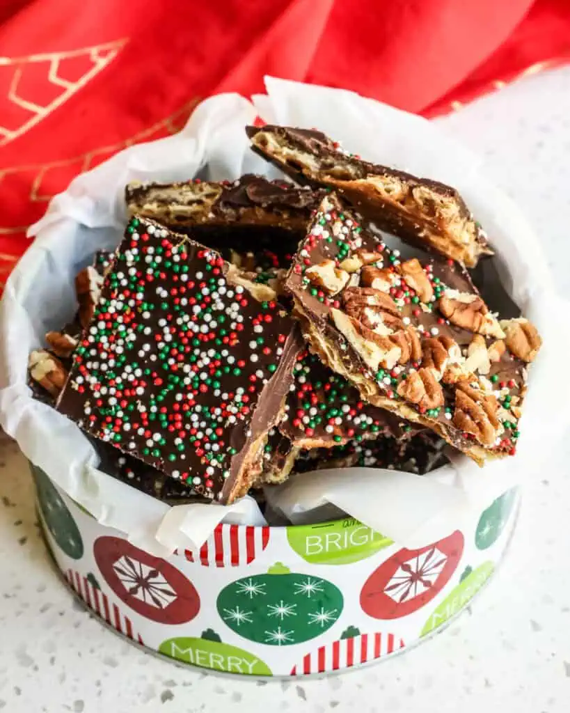 Pieces of Christmas crack in a Christmas tin. 