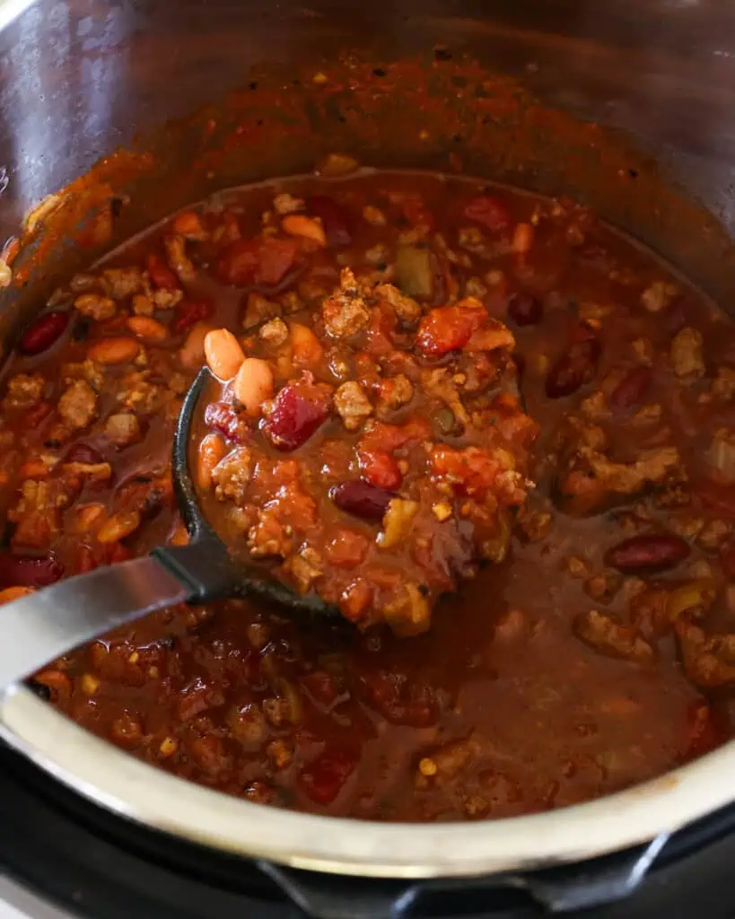 This quick and easy Instant Pot Chili combines crisp bacon, browned ground beef, onions, garlic, kidney beans, and a perfect blend of spices. 