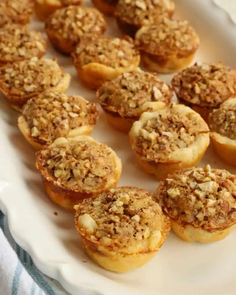 Pecan tassies on a serving platter. 