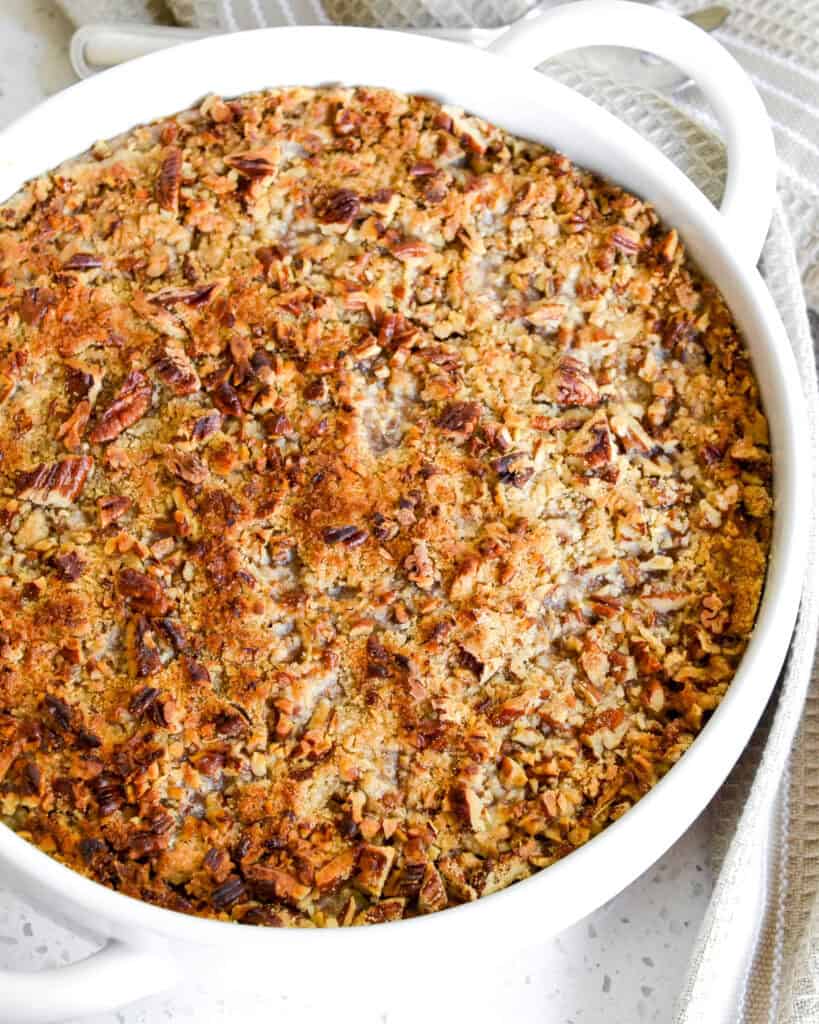 Overhead view of a round cassrole dish filled with sweet potato casserole. 