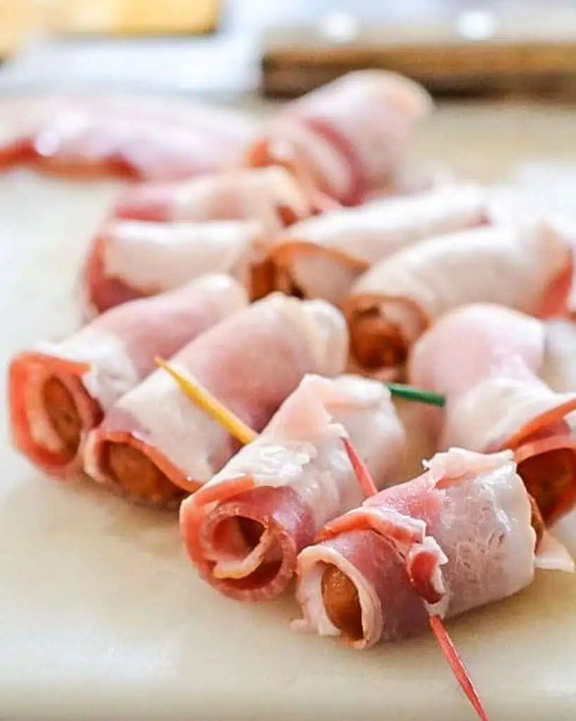 Bacon wrapped around little cockatil hotdogs and secured with at toothpick. 