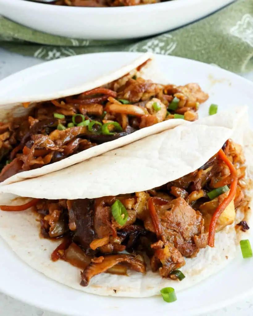 Moo shu pork in warm tortillas. 