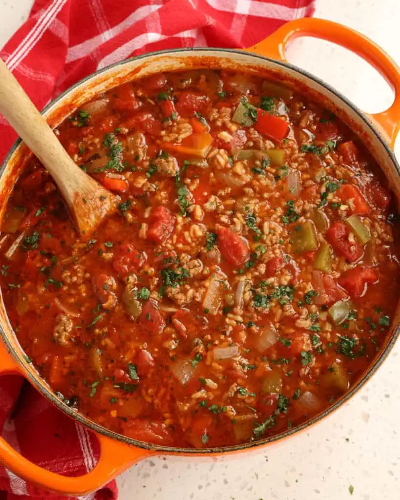 A Dutch oven full of stuffed pepper soup. 