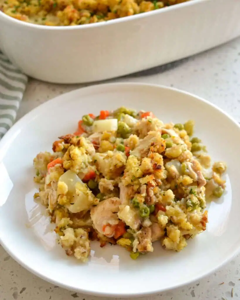 A single serving plate with chicken stuffing casserole. 