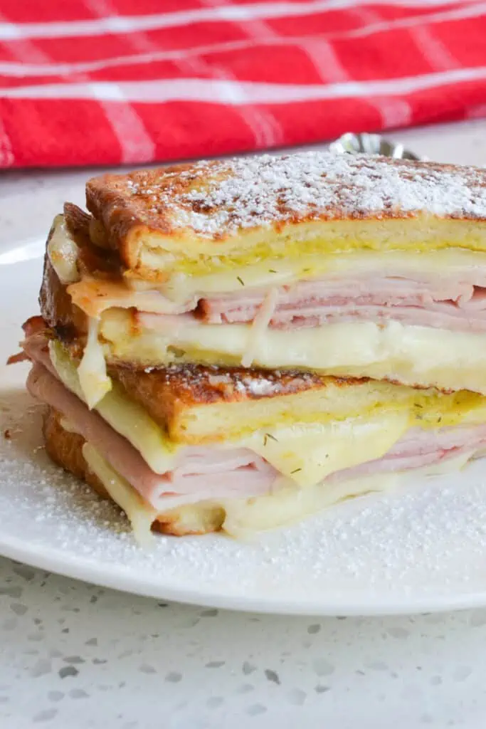 Sprinkle the sandwich with powdered sugar and serve with a side of raspberry preserves. 