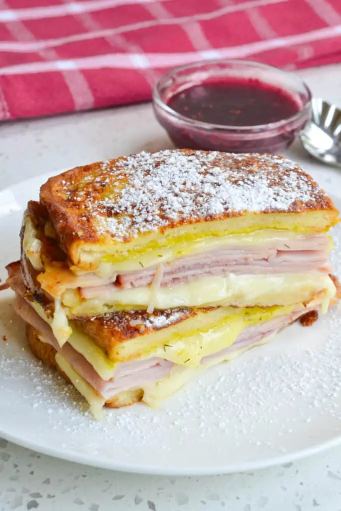 This tasty sandwich is layered with ham, turkey and cheese between bread that has been dipped in egg batter and pan fried.