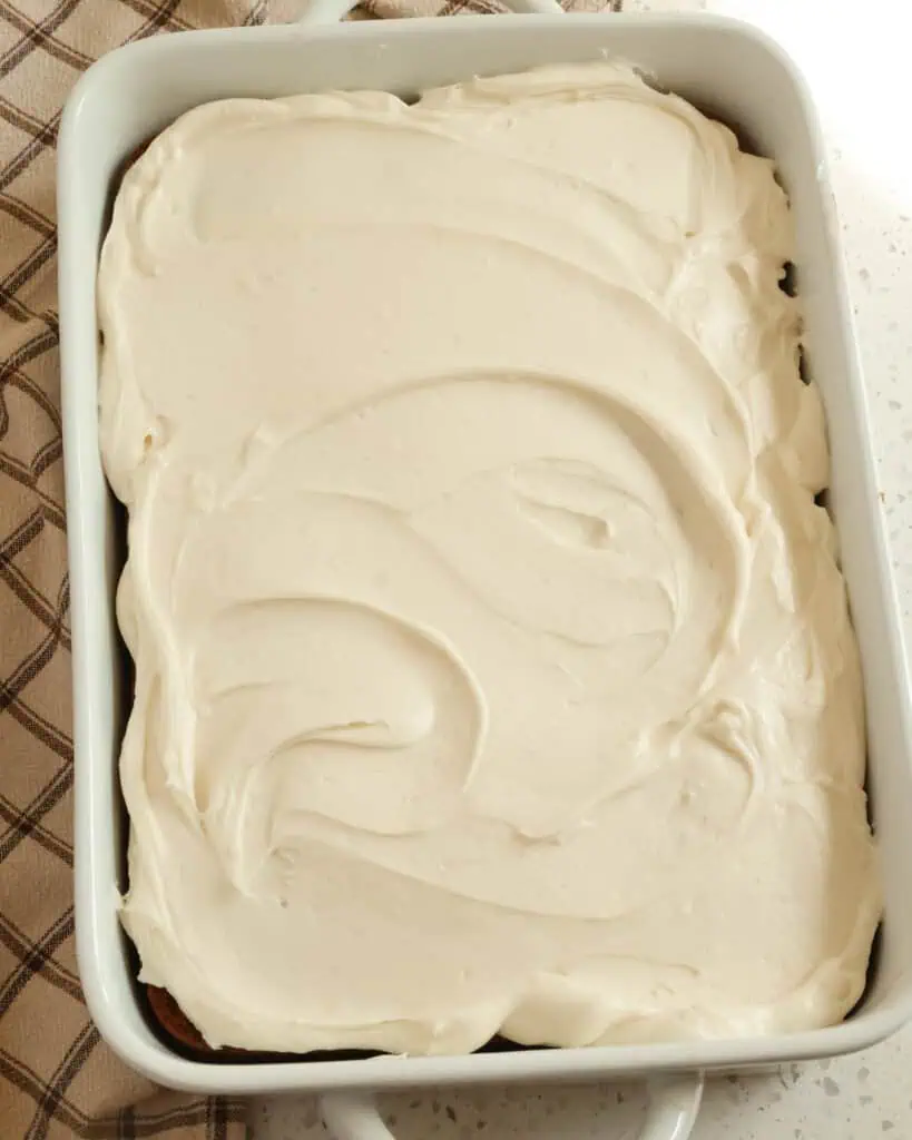 An overhead view of a spice cake baked in a 9x13 inch dish. 