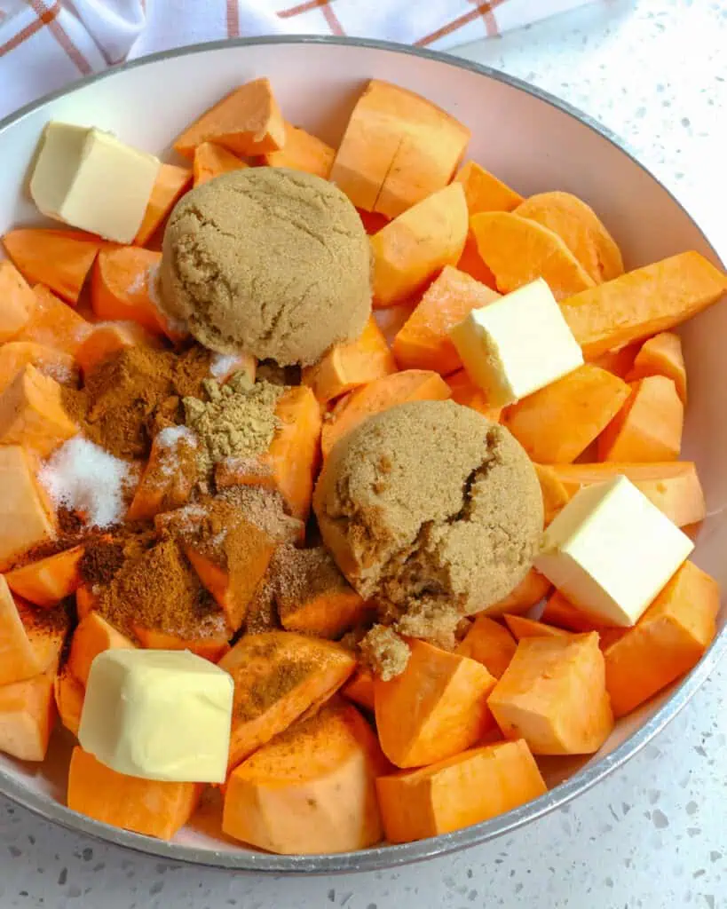 Add the sweet potatoes, sugars, butter, cinnamon, ginger, nutmeg, cloves, and vanilla to a large skillet or pot over medium heat.