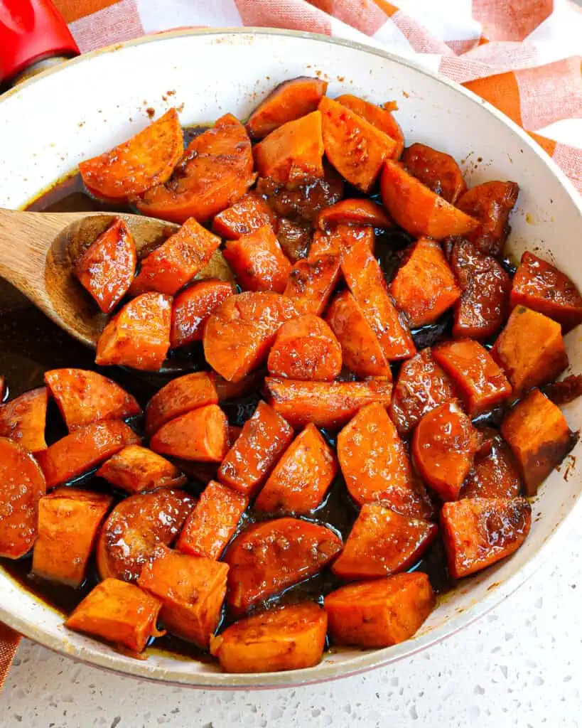 A skillet full of candied yams. 