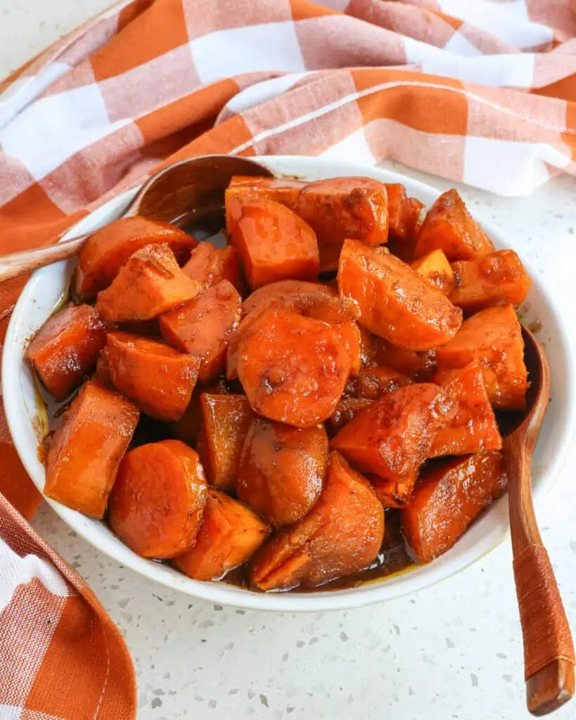 A serving bowl full of candied sweet potatoes. 