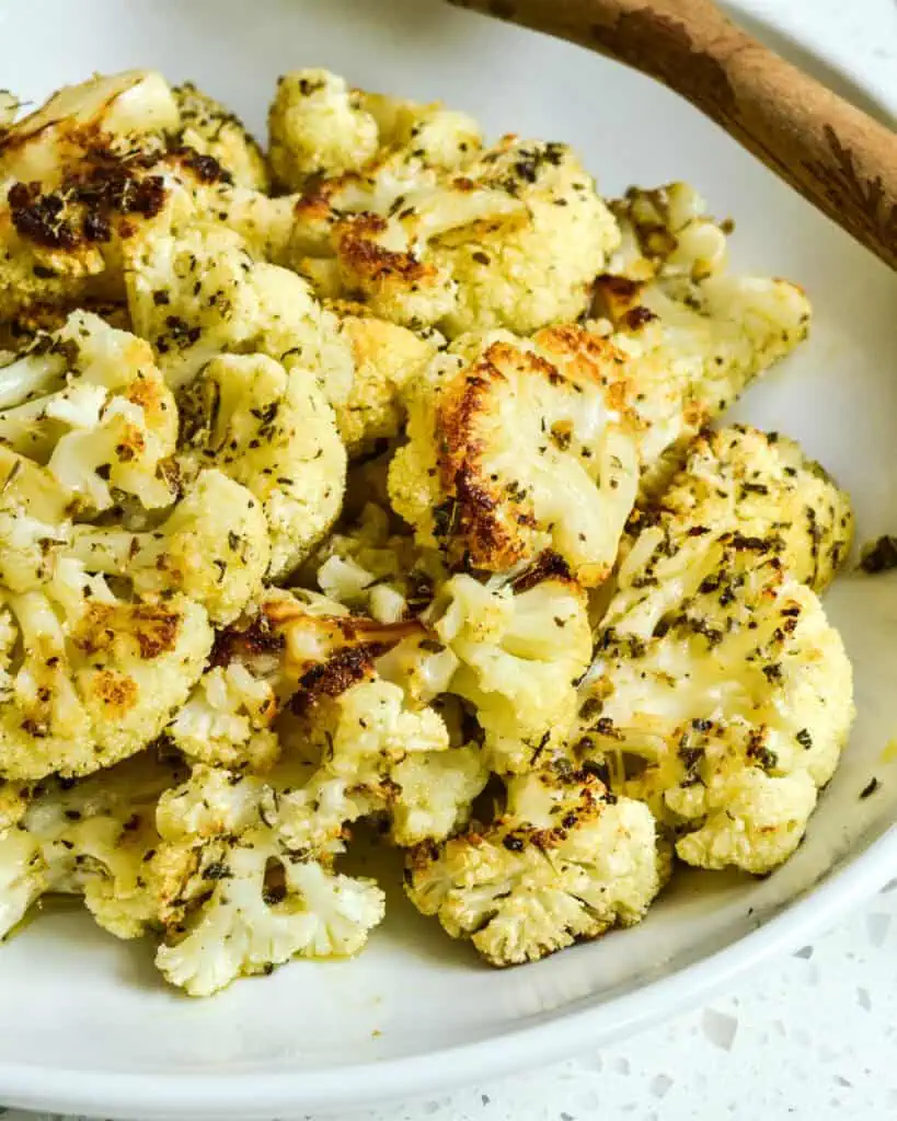 A bowl full of heart healthy roasted cauliflower. 