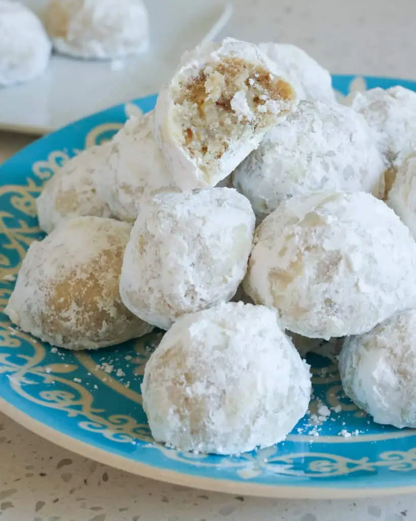 Snowball cookies on a serving plate. 