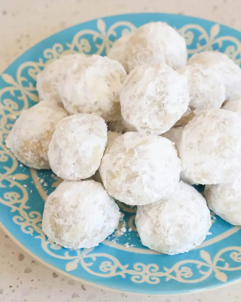 Close up view of Italian wedding cookies on a serving dish.