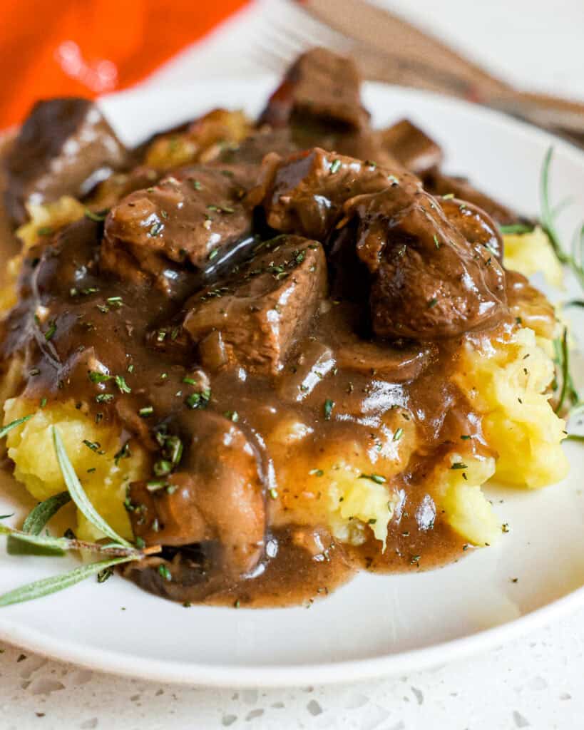 Beef Tips and Gravy combine tender beef chunks, mushrooms, onions, and garlic in a rich and smooth brown gravy that is lightly seasoned. 