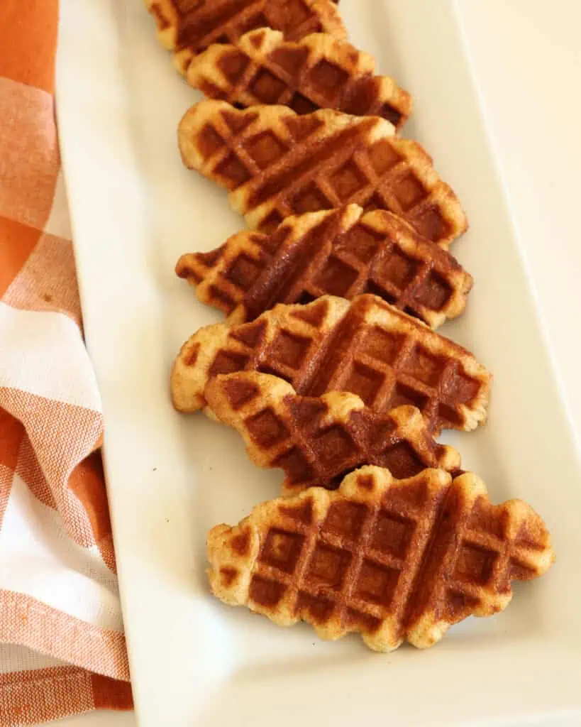 A serving plate full of croffles. 