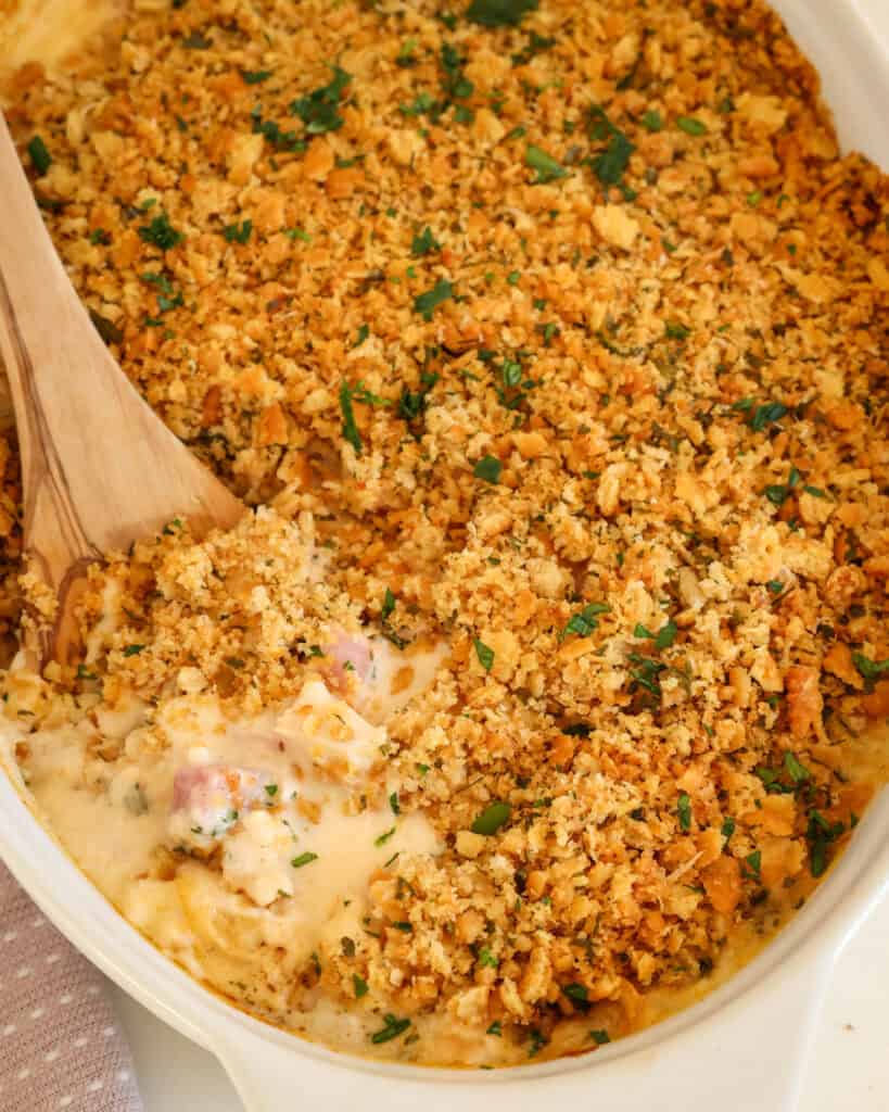 Chicken cordon bleu casserole in a white oval casseerole dish. 