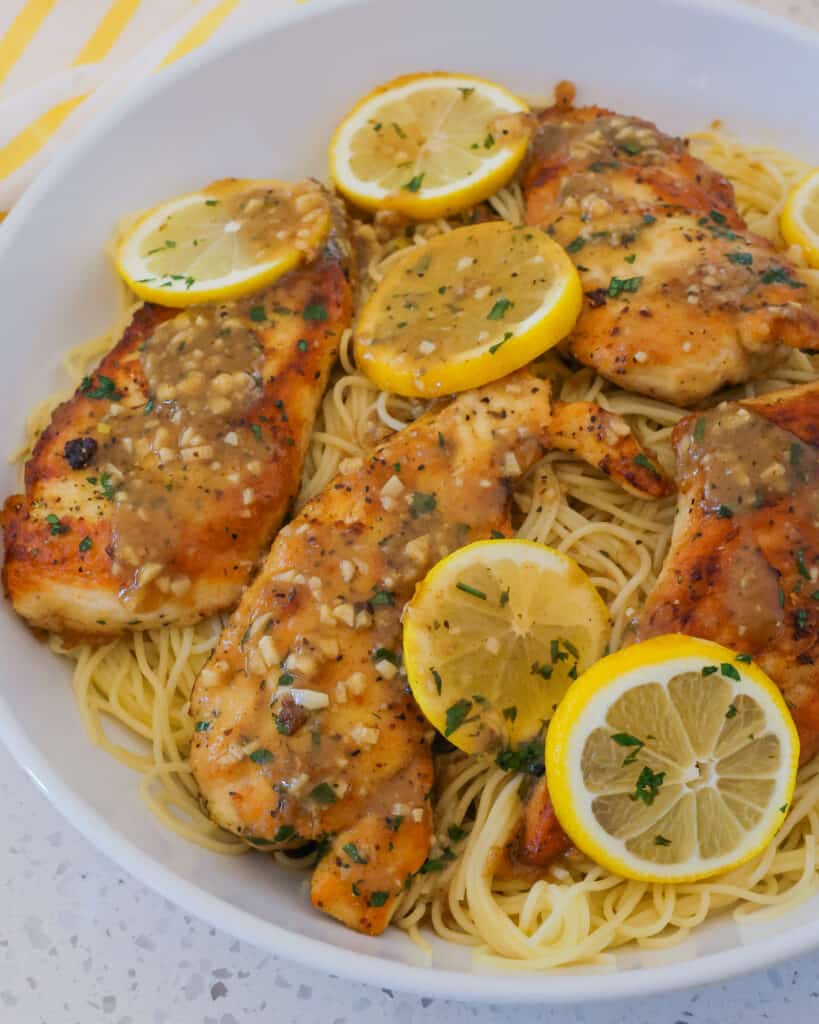 Lemon Pepper Chicken is an easy weeknight meal that comes together quickly in one skillet.  It combines lemon pepper breaded chicken with garlic and lemons in a light lemon sauce made with a splash of real lemon juice.