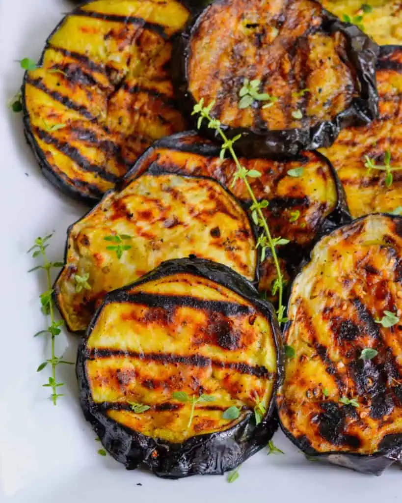 This delicious and easy Grilled Eggplant recipe is brushed with olive oil and seasoned with marjoram and thyme.  Enjoy some today and reap the health benefits of fresh eggplant.