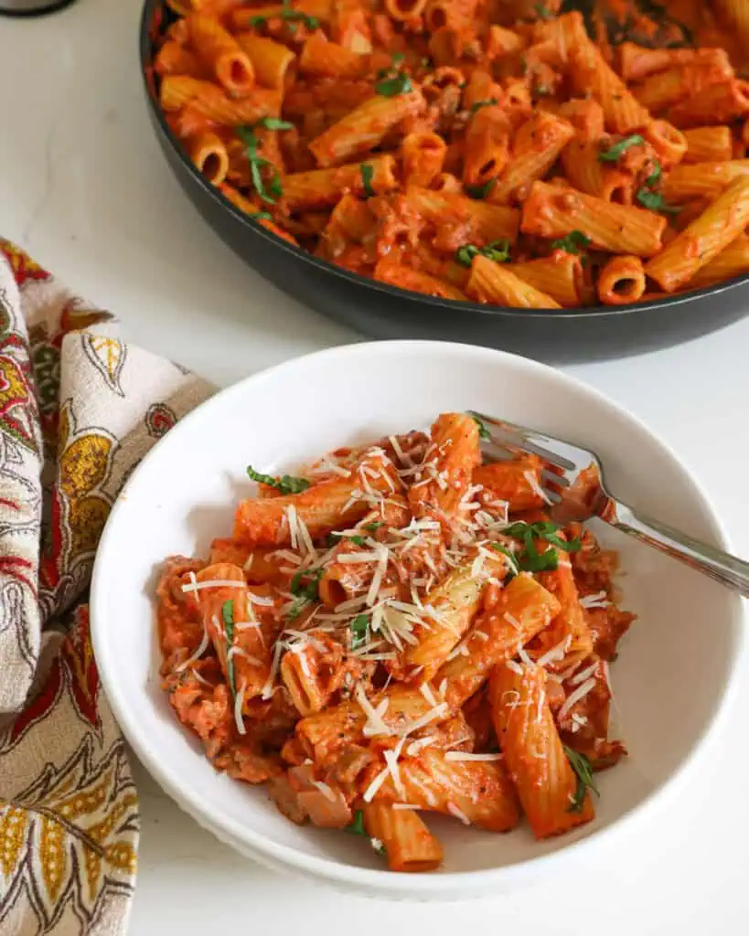 Enjoy this quick and tasty sausage rigatoni recipe with creamy homemade marinara sauce and freshly grated Parmesan cheese.