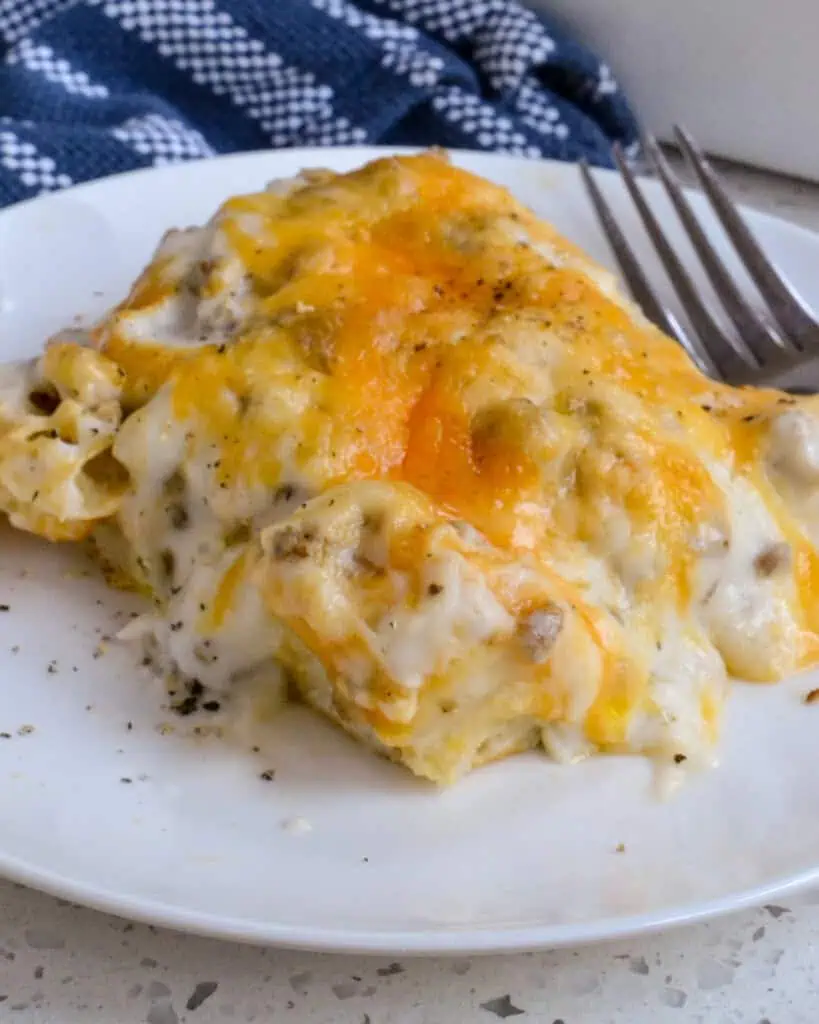 Biscuits and Gravy Casserole combines fluffy biscuits, breakfast sausage, eggs, Colby cheese, and white sausage gravy into one of the most delicious casseroles ever. 
