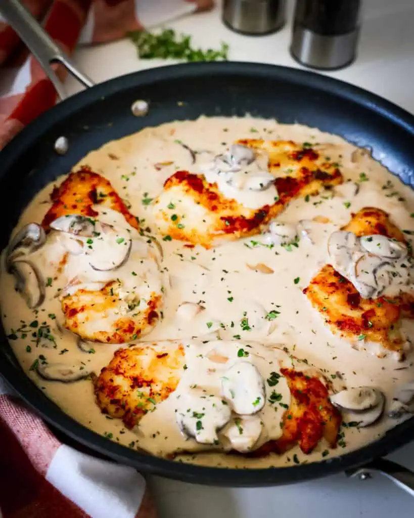 Cooked chicken marsala in a large skillet. 