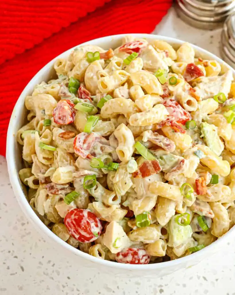 A small bowl of chicken pasta salad. 