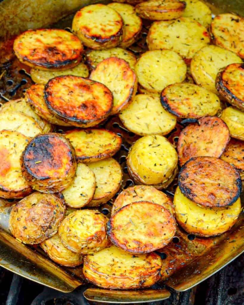 Grilled potatoes in a grill basket