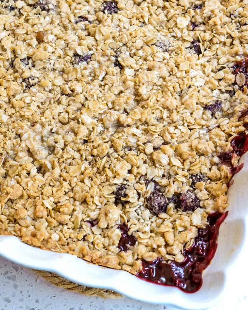 Straight out of the oven blackberry crisp with bubbly edges. 