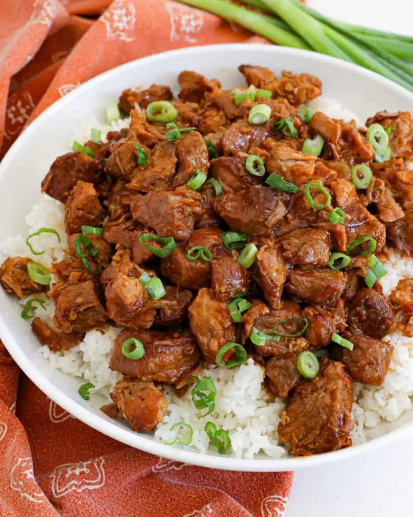 Tender bites of braised pork are combined with onions and garlic in a sweet and spicy ginger sauce.