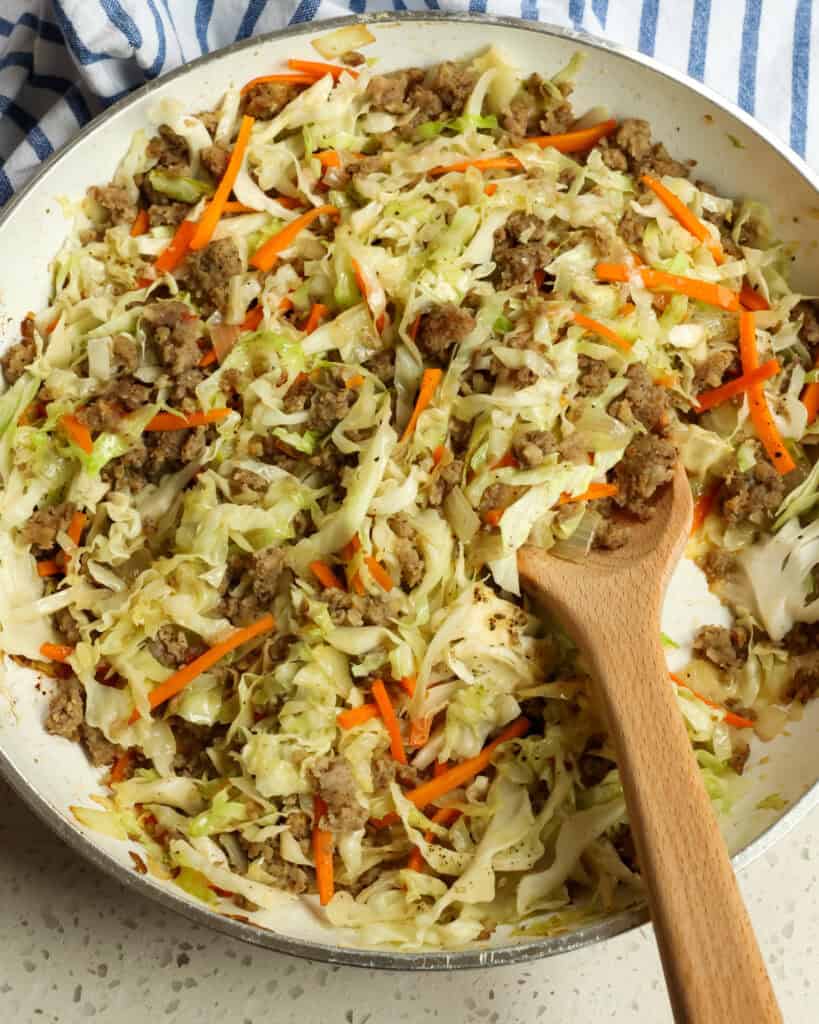 A large skillet full of egg roll in a bowl. 