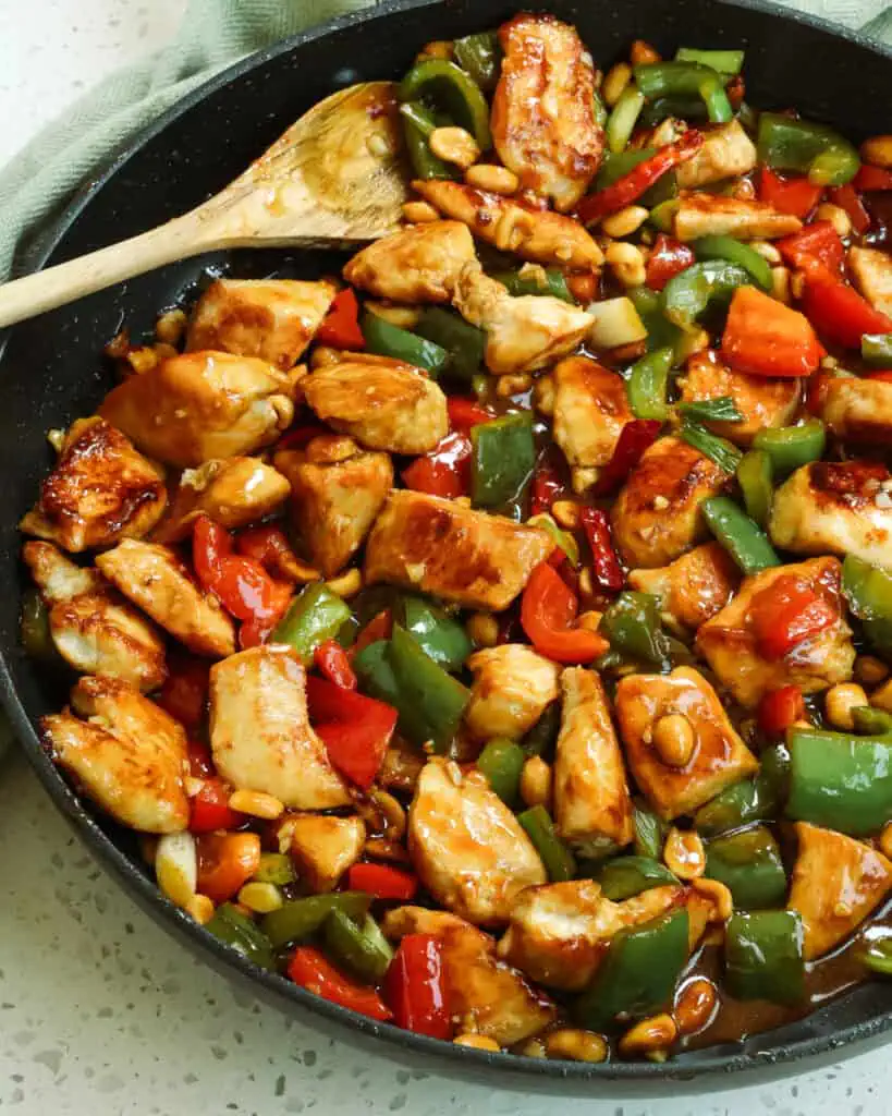 Kung Pao Chicken is the ultimate stir-fried experience.  It is loaded with delicious flavor from tender marinated chicken, bell peppers, green onion, and peanuts in a sweet and salty, slightly spicy sauce that leaves you licking your plate. 