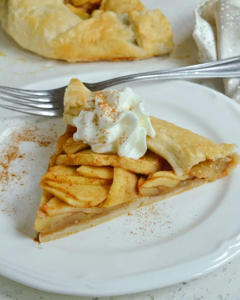 Apple galette on a plate with a fork. 