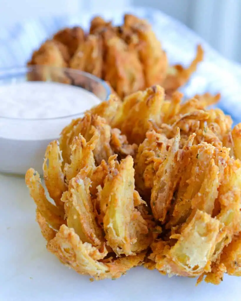 Fried blooming onions on a serving platter. 