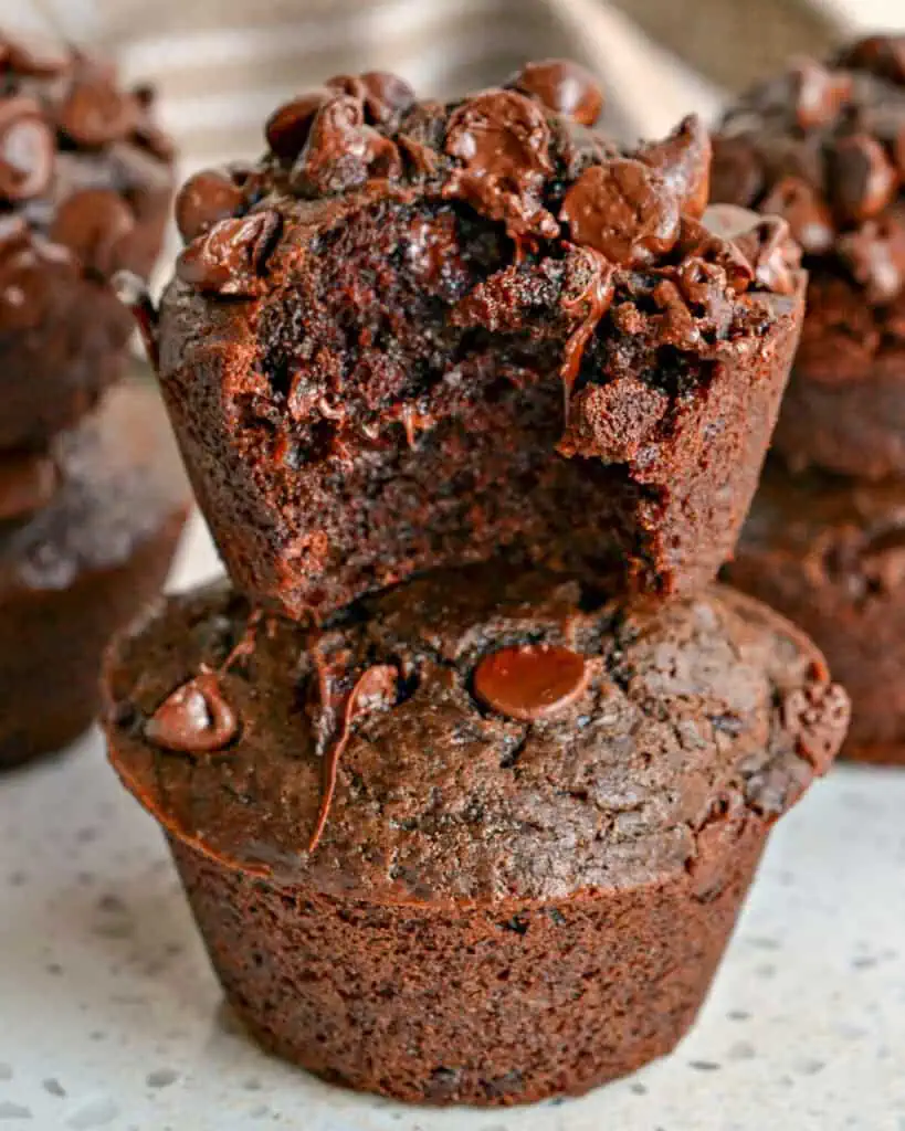 Two double chocolate muffins stacked. 
