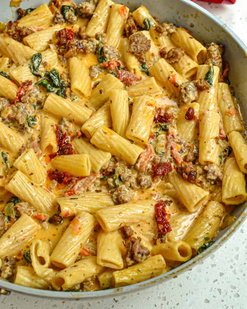 A close up view of Italian Sausage Pasta in the skillet. 