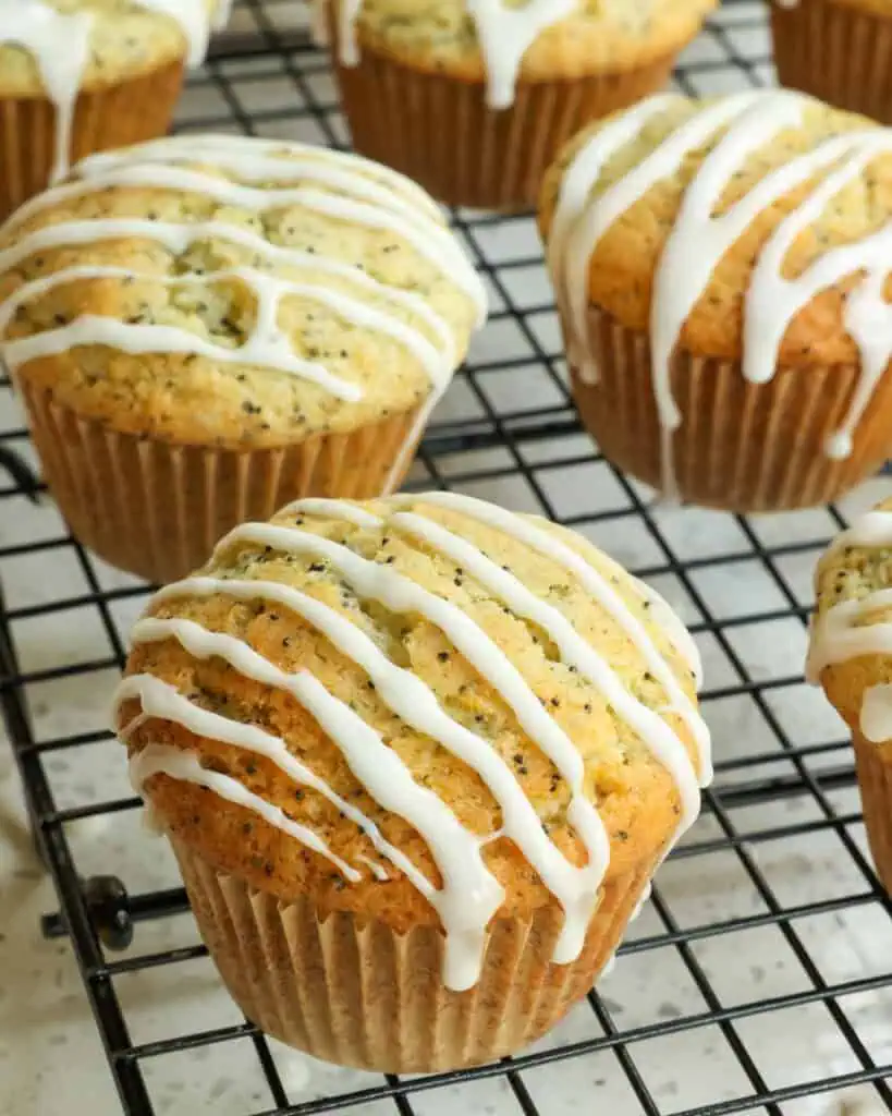 Deliciously moist Lemon Poppy Seed Muffins made with sour cream. lemon zest, lemon juice, and an easy lemon glaze. 