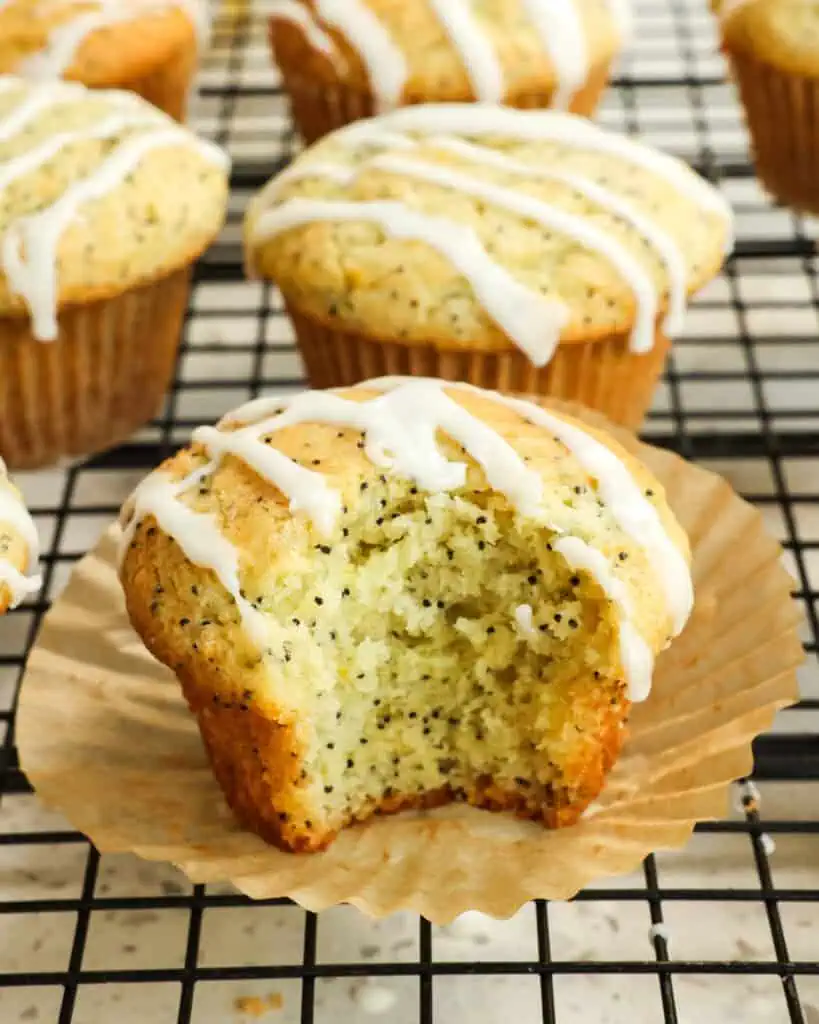 Lemon poppyseed muffins on a wire rack cooling